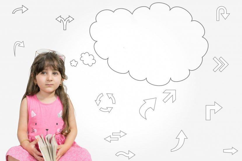 Girl thinking with diagrams
