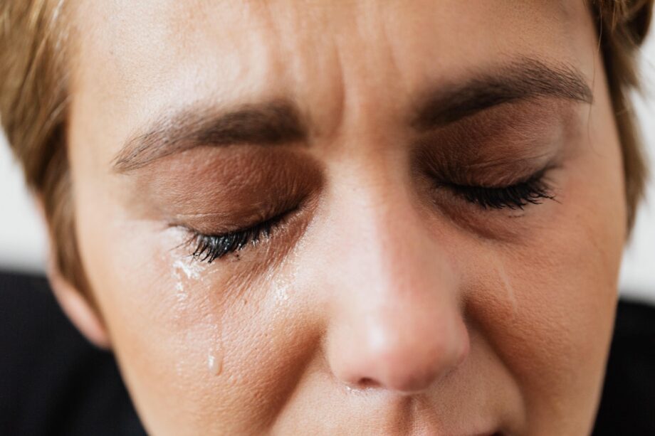 Woman's face crying not coping during covid