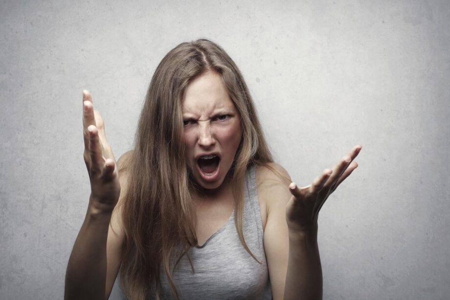 Woman with hands raised