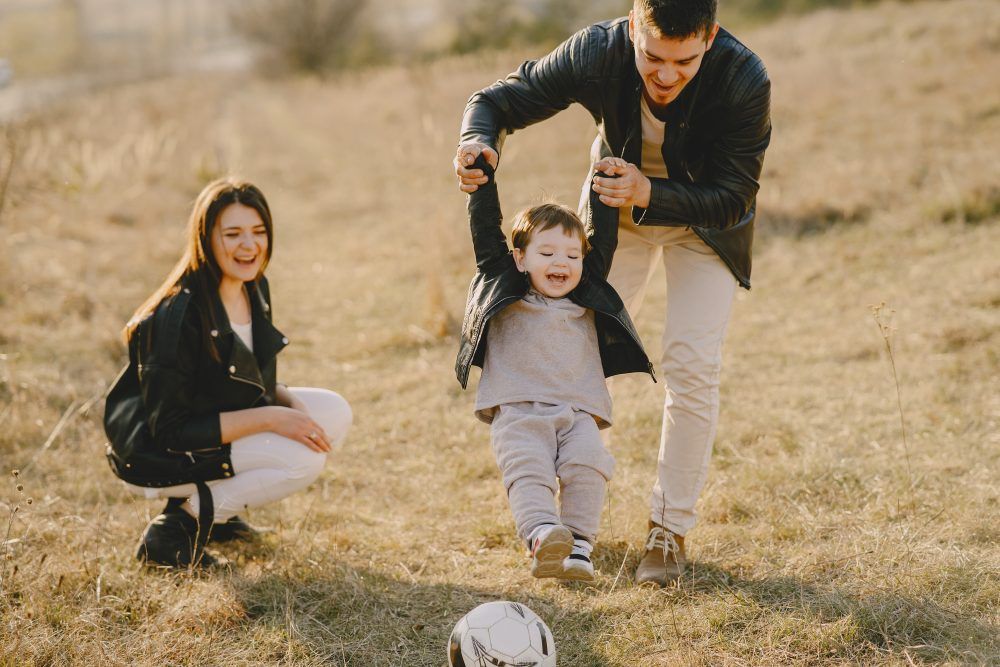Family playing with child