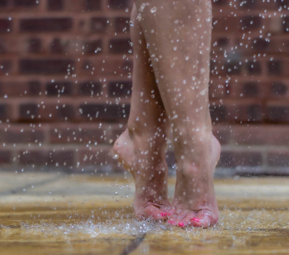 feet in splashes of water