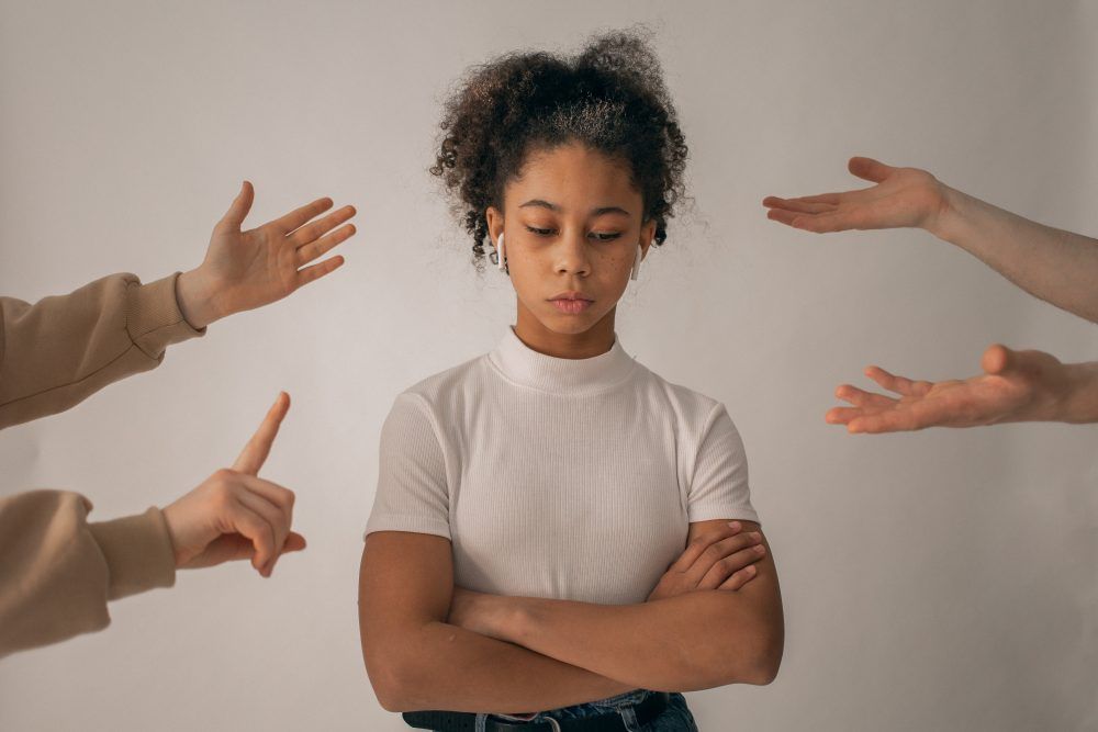 Girl with hands pointing towards her