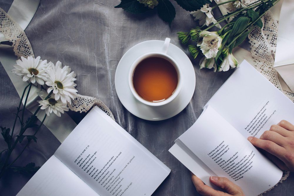 Overhead view of coffee and books