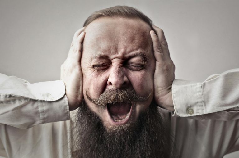 Amongst the Noise man holding head