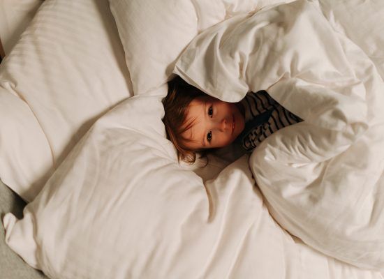 sleepless child in a bed
