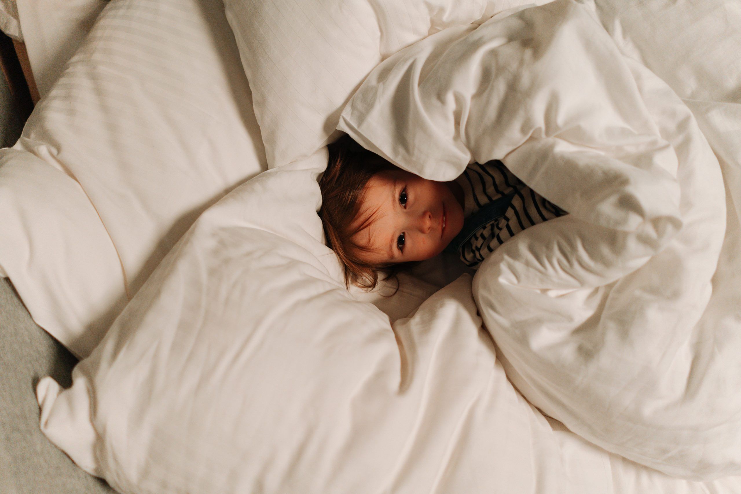 sleepless child in a bed